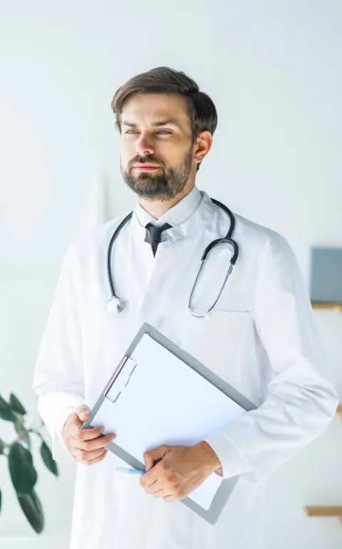 Medical professional holding a clipboard